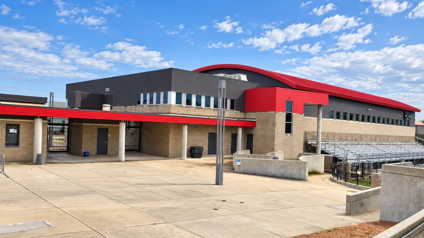 The stadium plaza at an Alabama high school in 2021, its brick and mortar one even color seven years after the mortar was stained