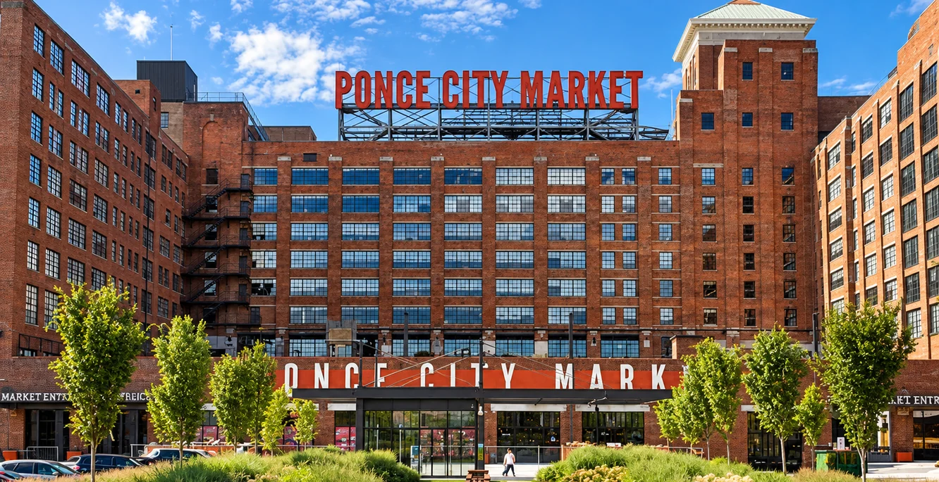 Ponce City Market in Atlanta, the red brick former Sears building, its rooftop sign above a planted plaza