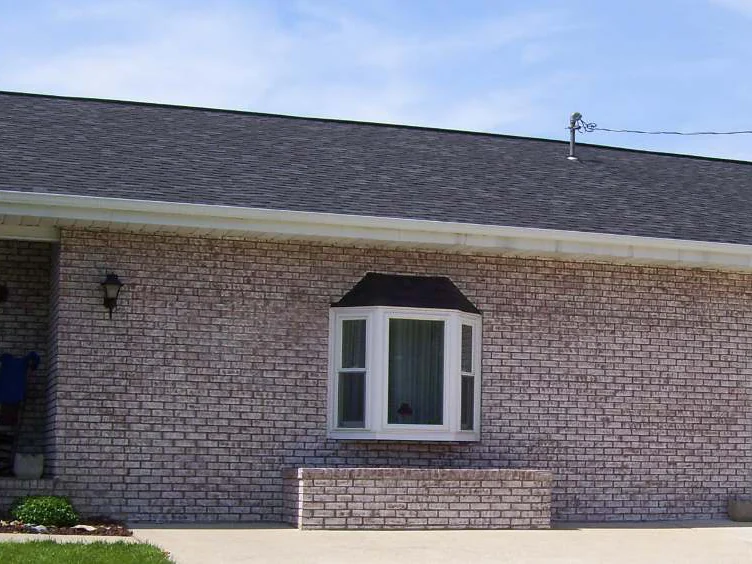 The front elevation later in 2008, the bay window and the garage wall now reading as one pale range from the porch to the garage door