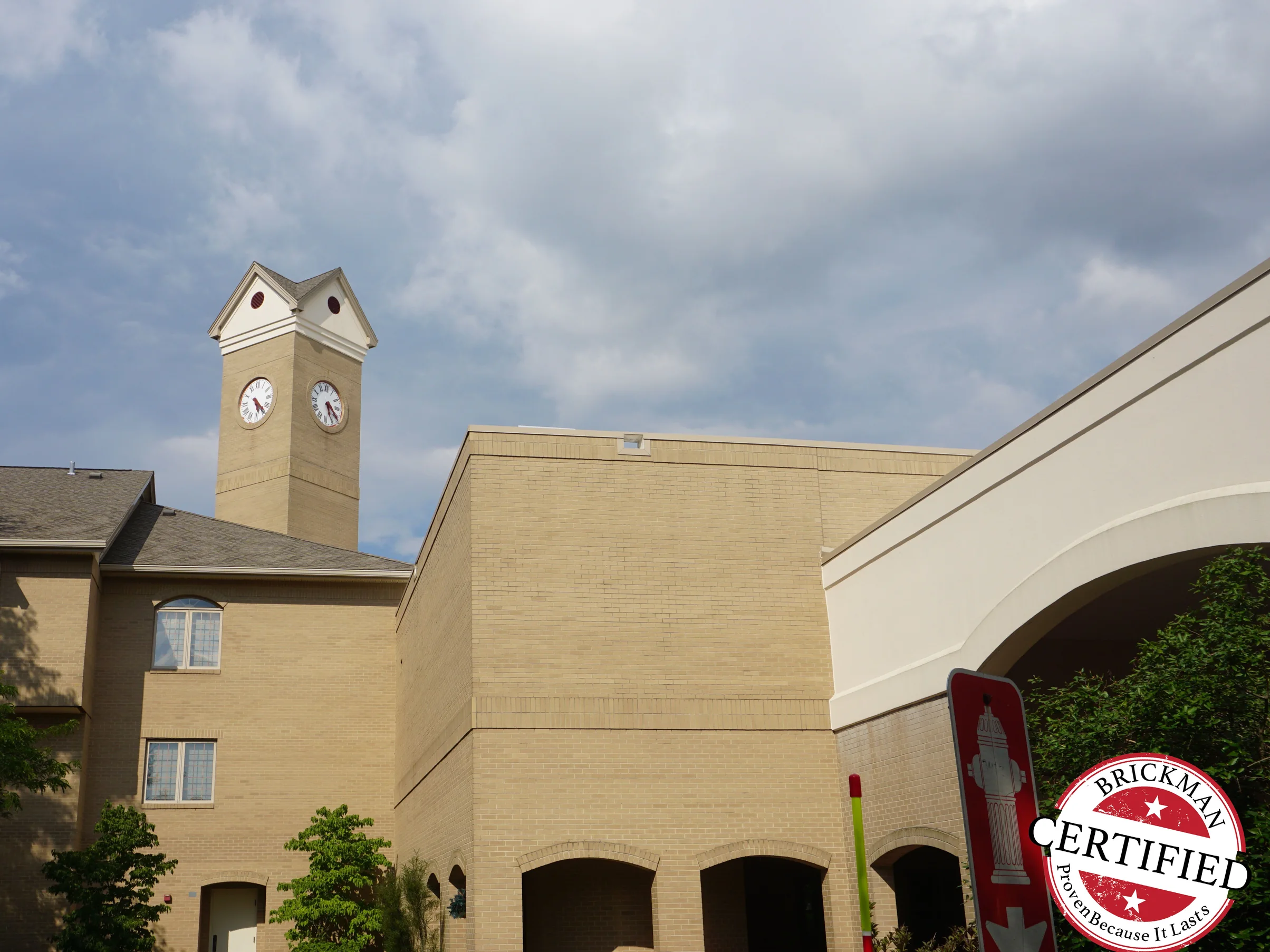 The clocktower above the community buildings in 2019, the frame carrying the Brickman Certified stamp