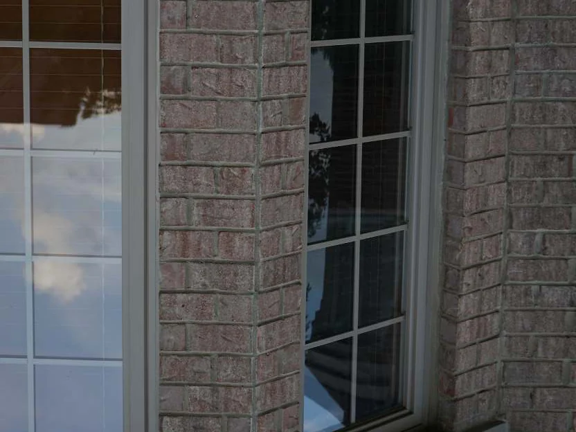 The brick piers either side of the bay window in 2020, the header faces still sitting in the same range as the wall around them