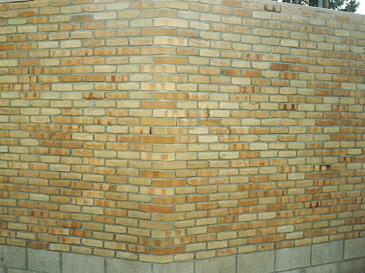 The same corner in 1996 after staining, the corner units carrying the same range of tans and browns as the stretchers on either side