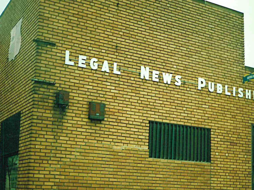 The same office from its outside corner in 1996 after staining, the wall reading as one buff and tan range with the replacement area no longer standing apart