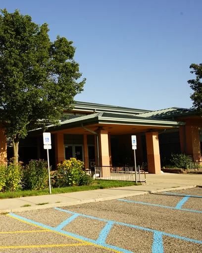 A recreation center in Dearborn Heights, Michigan in 2019, its brick walls nineteen years after staining