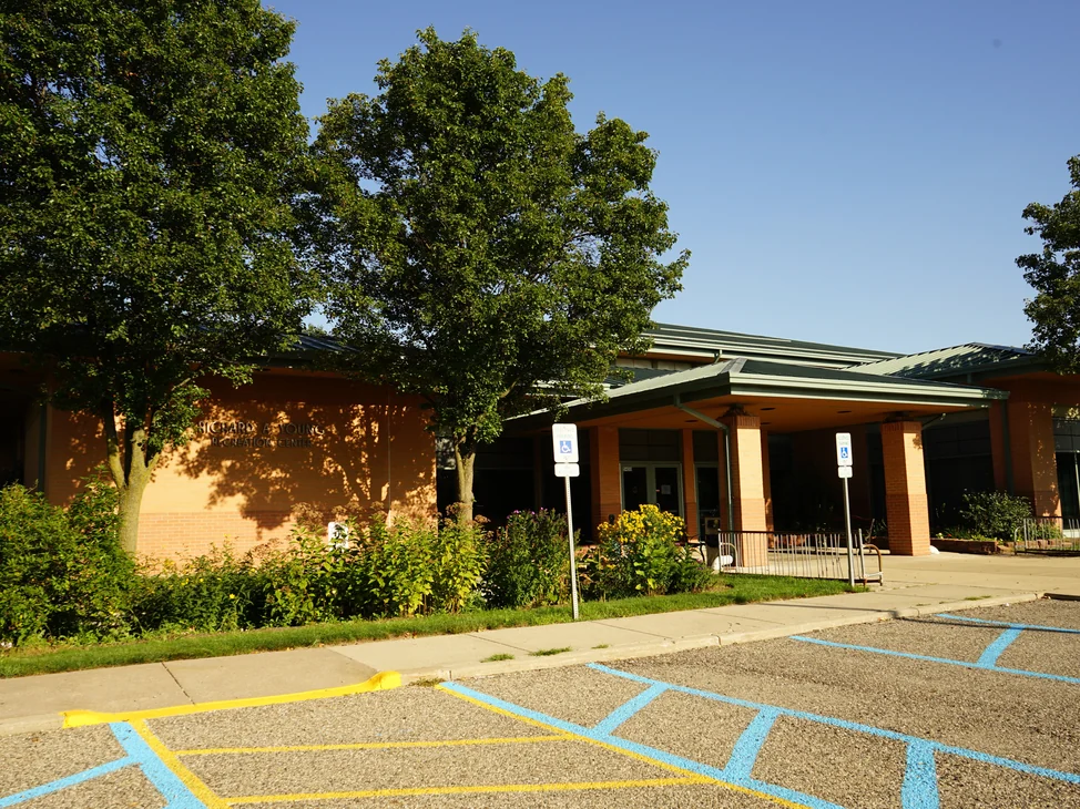 The Richard A. Young Recreation Center from its parking lot in 2019, the brick reading as one warm red and tan range.