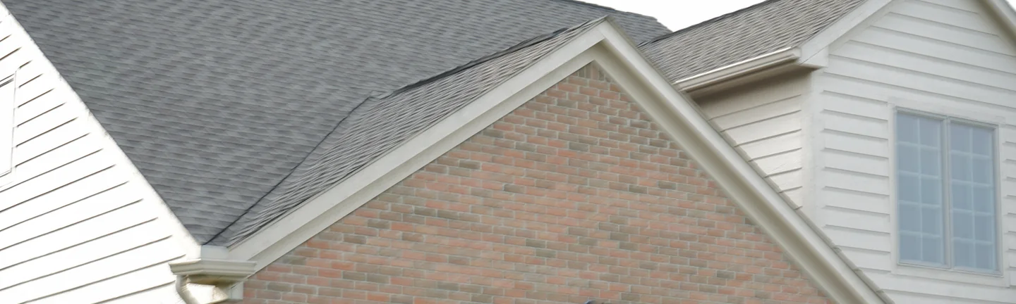 The garage gable of the Dodge Park house in 2019, its brick reading as one even range of red and tan