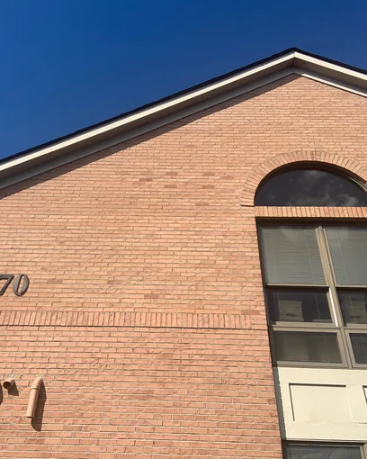 The brick gable of a Dublin, Ohio office center in 2019, one even range fourteen years after the dark areas were lightened