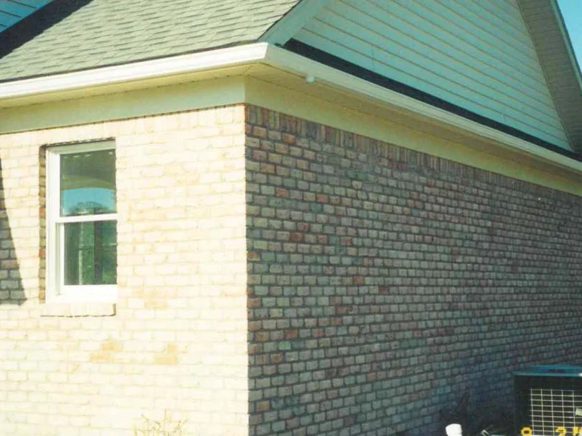 The outside corner in 1999, the front wall reading pale cream against a side wall several shades darker in the same light