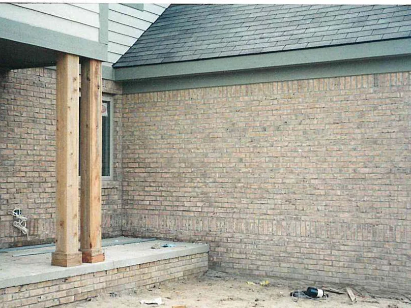 The same porch wall in 1998 after the work, the lower courses lightened to the range of the courses above them