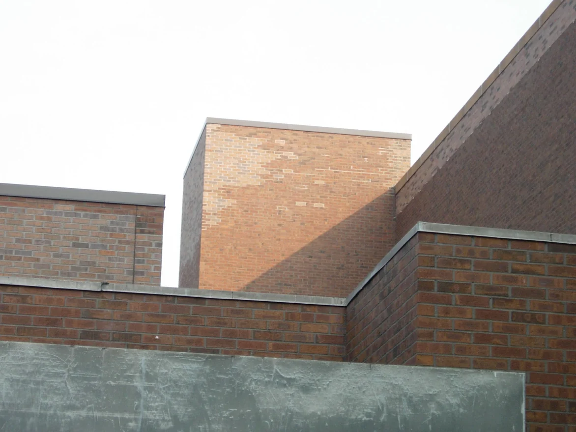 Roof level of the building in 2007, a block of pale buff brick set into walls of red and brown brick
