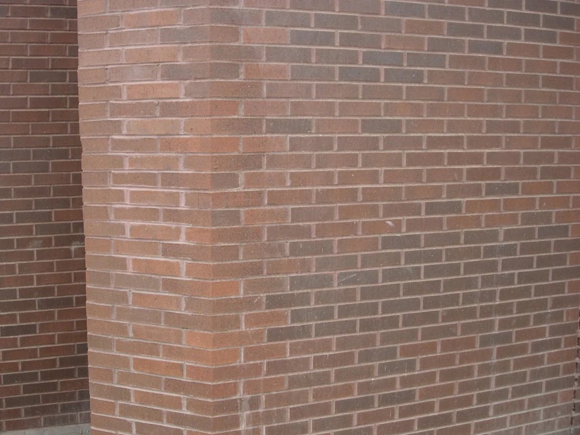 The same corner later in 2007, the shaped corner units now sitting in the same red brown range as the flat brick either side of them