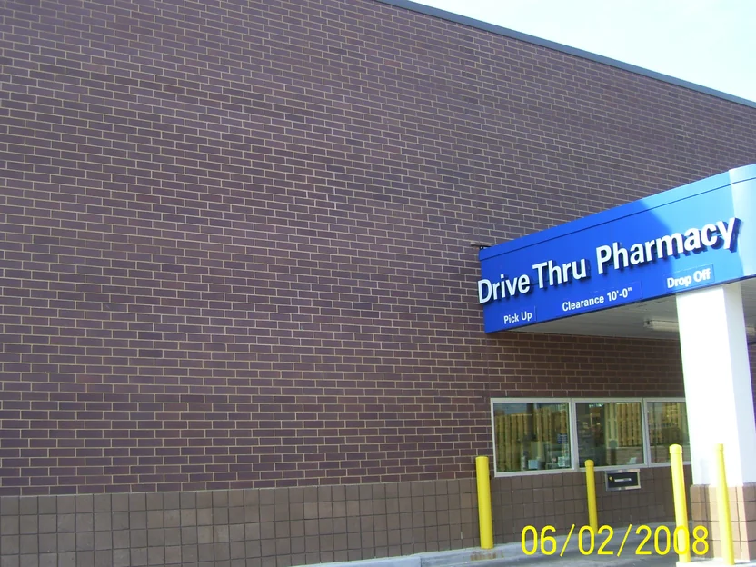 The same wall in June 2008 after the light units were darkened, the brick reading one dark brown from the block base to the roofline