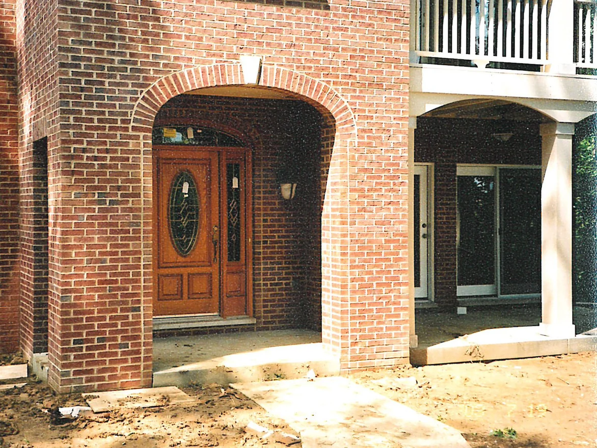 The same entry in 2003 from further back, the brick low on both pillars now a deeper red brown that carries across into the house wall beside them