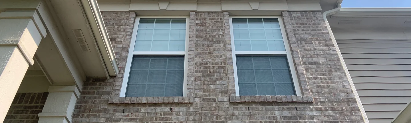 The upper brick of an Indiana house in 2019, reading as one even tan and cream range