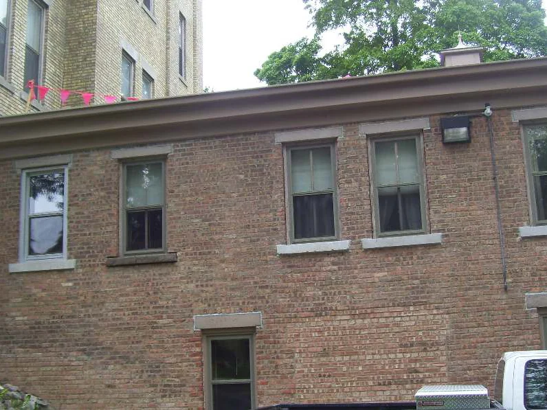 The addition in 2006, two storeys of red brown brick running right from the buff cream main building it is attached to