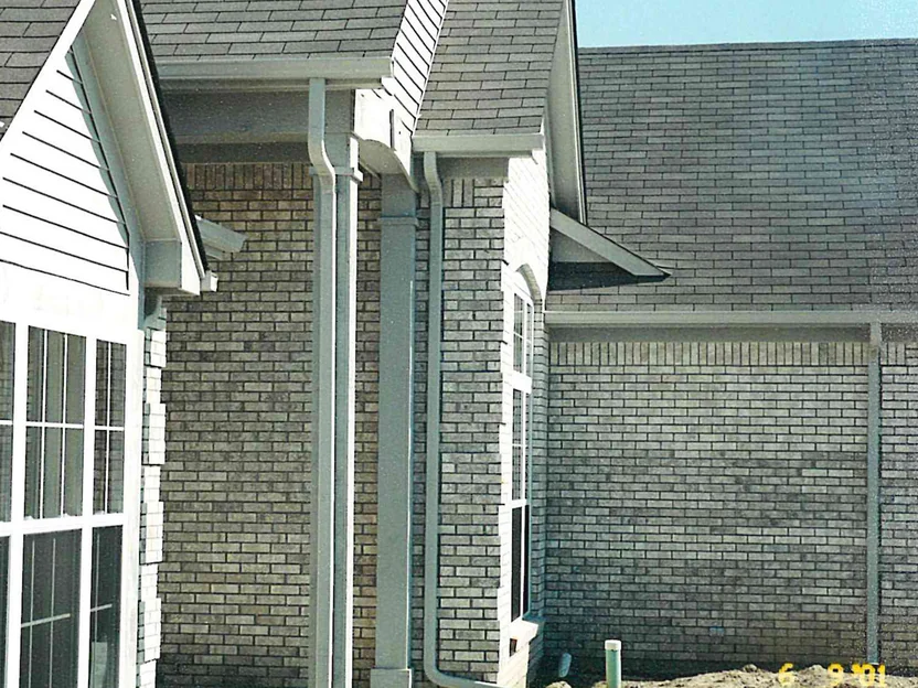 The entry gable and the garage wall in 2001, the brick running uneven in color from one section to the next