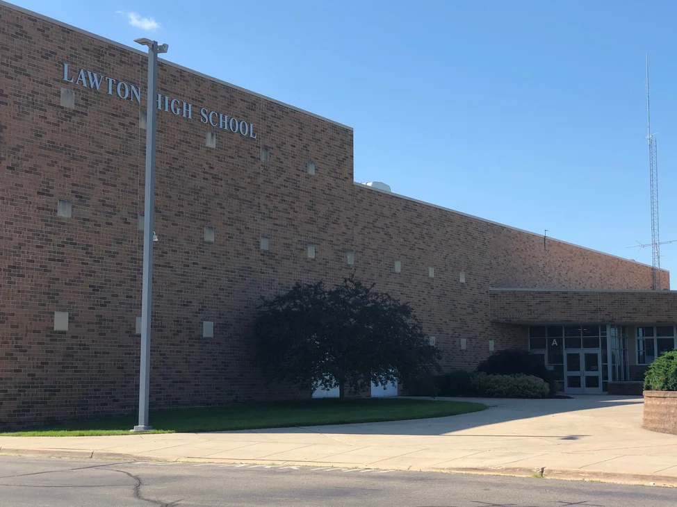 The front of Lawton High School in 2019, the brick reading as one range along the whole wall
