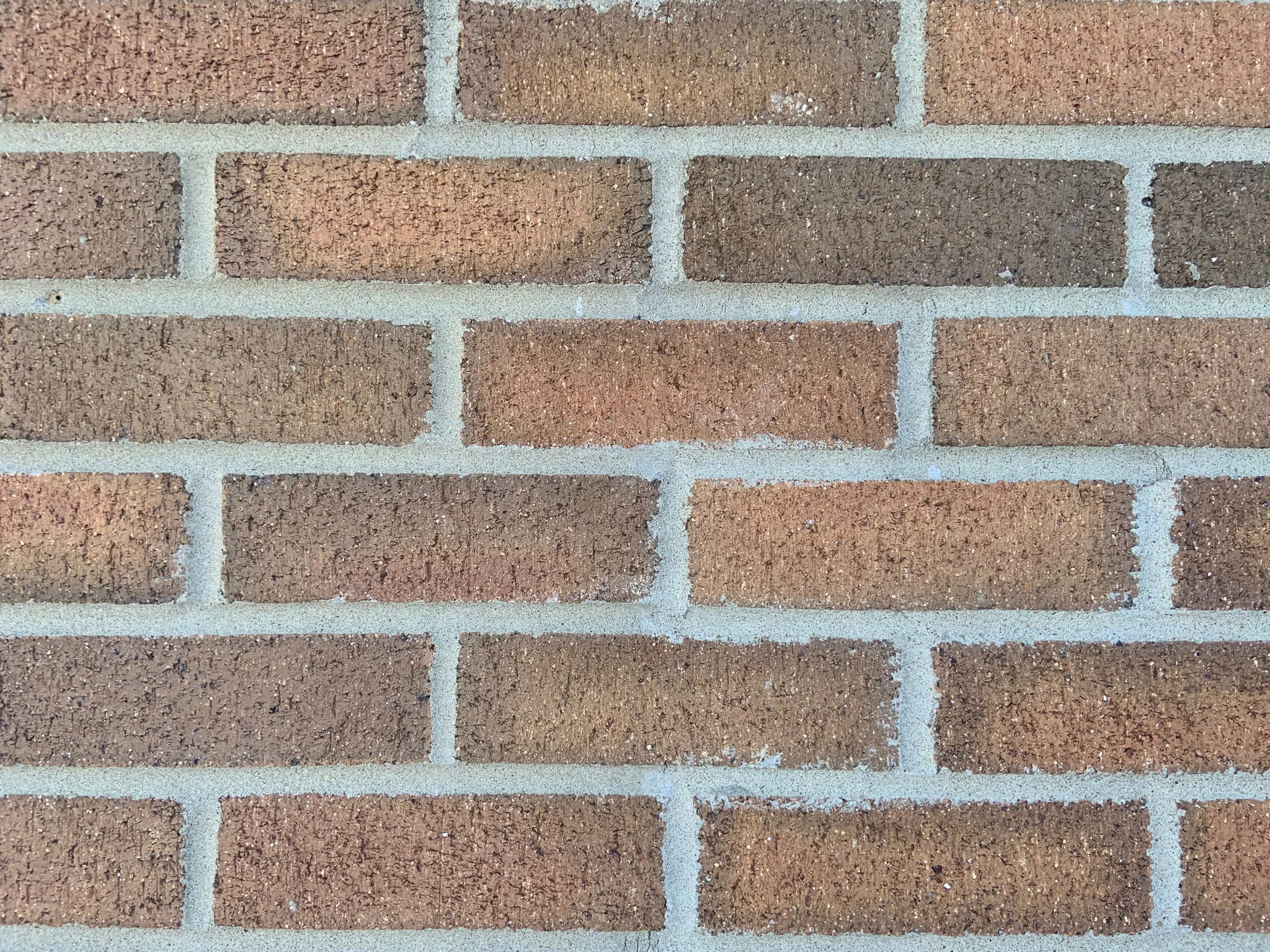 Close view of the blended brick in 2019, no two neighboring units the same, in reds, tans and browns