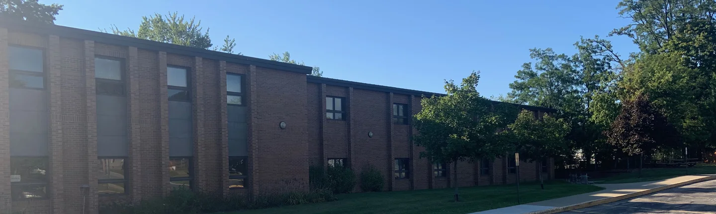 The Lincoln School classroom wing in 2019, its brick an even red and brown range across the elevation