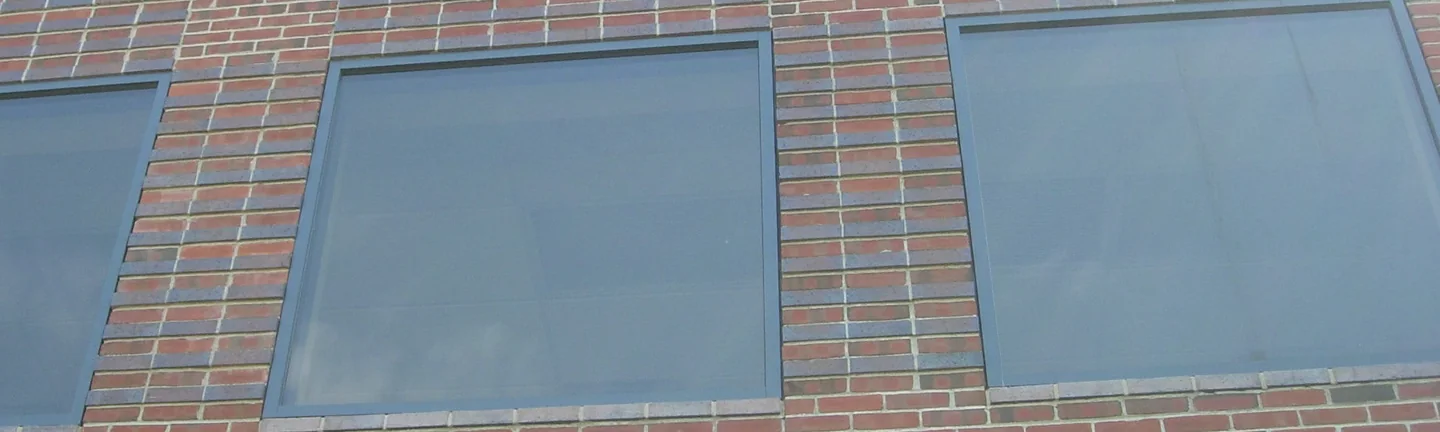 A window band on the college in 2019, the brick around it holding one even red range