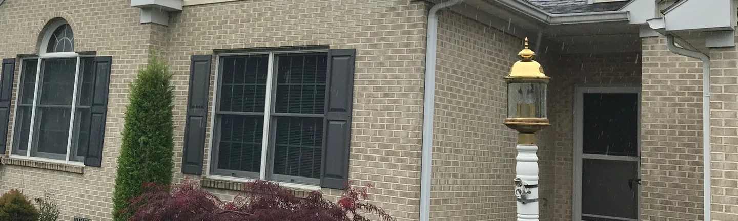 The front of the house in 2019, its brick reading as one even sand color across the whole elevation