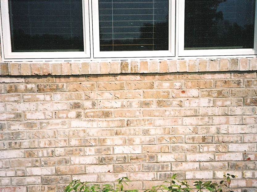 Close view of the brick under a front window in 2003, cream, tan and buff units reading as one range under a white sill