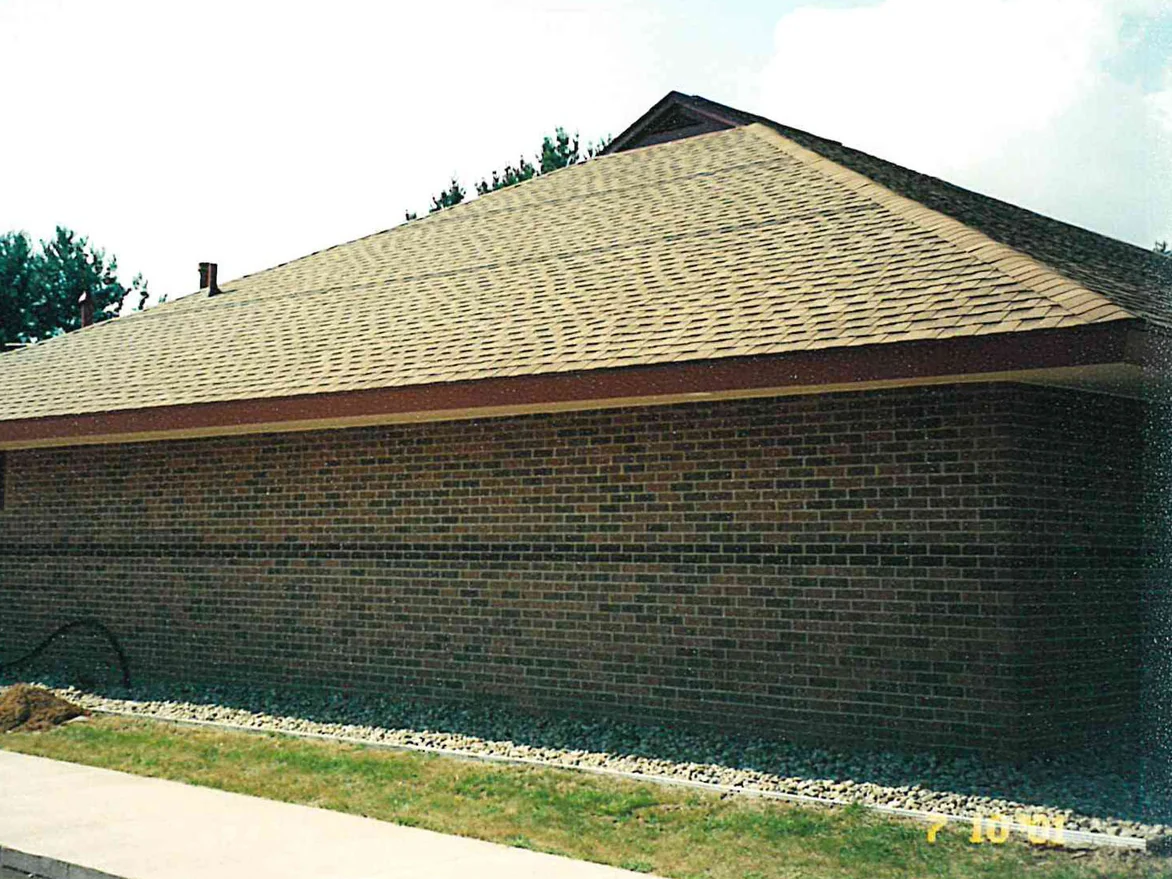 The same office later in 2001, the end wall and the return past the corner now reading dark brown under the roofline