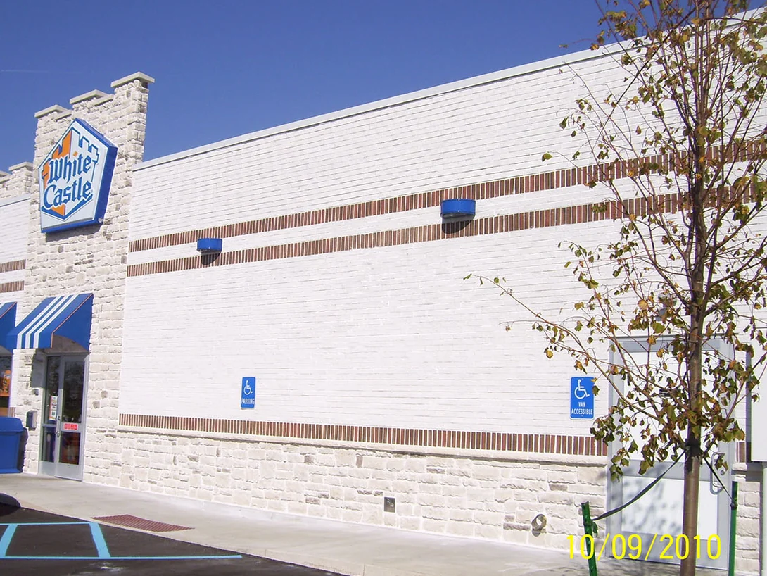 The finished restaurant in 2010, its white brick elevation running back from the White Castle sign above two courses of dark brick banding