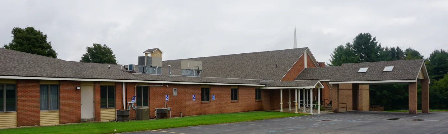 The long brick wing of the Middleville church in 2019, its brick one even red brown from end to end