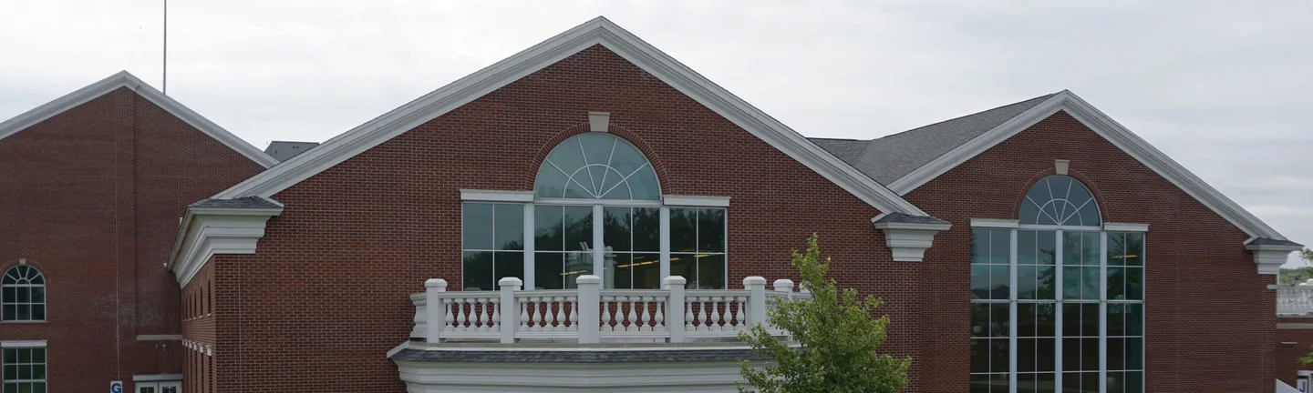 The brick of the hospital pavilion in 2019, one even red range from the gables down to the balustrade