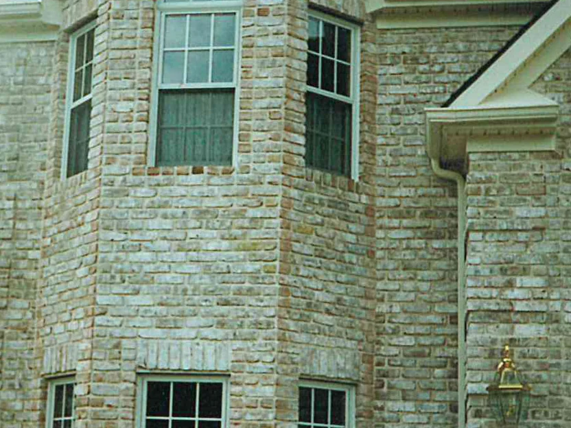 The canted bay in 1998, the shaped bricks turning its angled corners reading darker and more orange than the cream brick around them