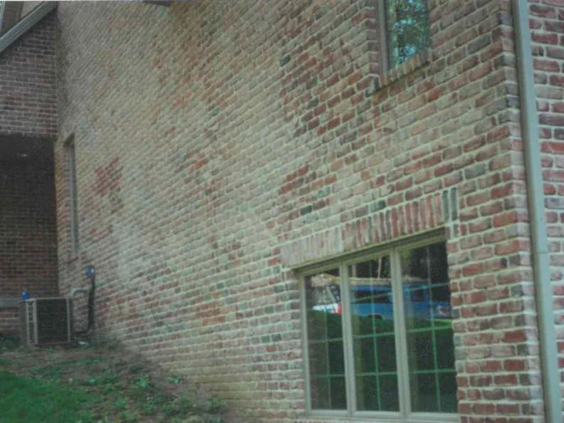 The long side wall in 1997, its brick bleached pale and blotchy from the corner across to the window while the return wall at the right still runs red and buff