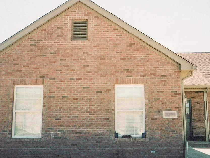 The same gable end later in 2002, the brick now reading as one even blend across the whole wall