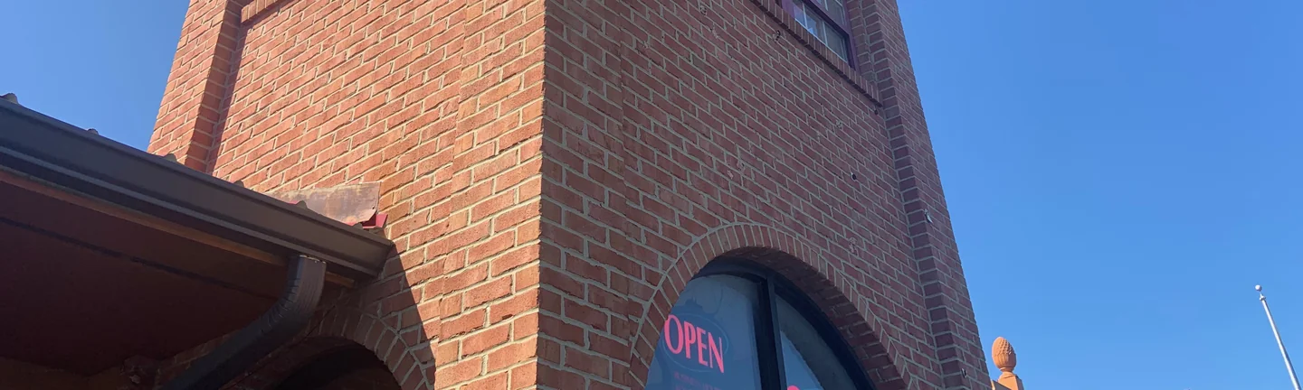 The brick entry tower of the Ohio restaurant in 2019, two faces of red brick meeting at the corner against a clear sky