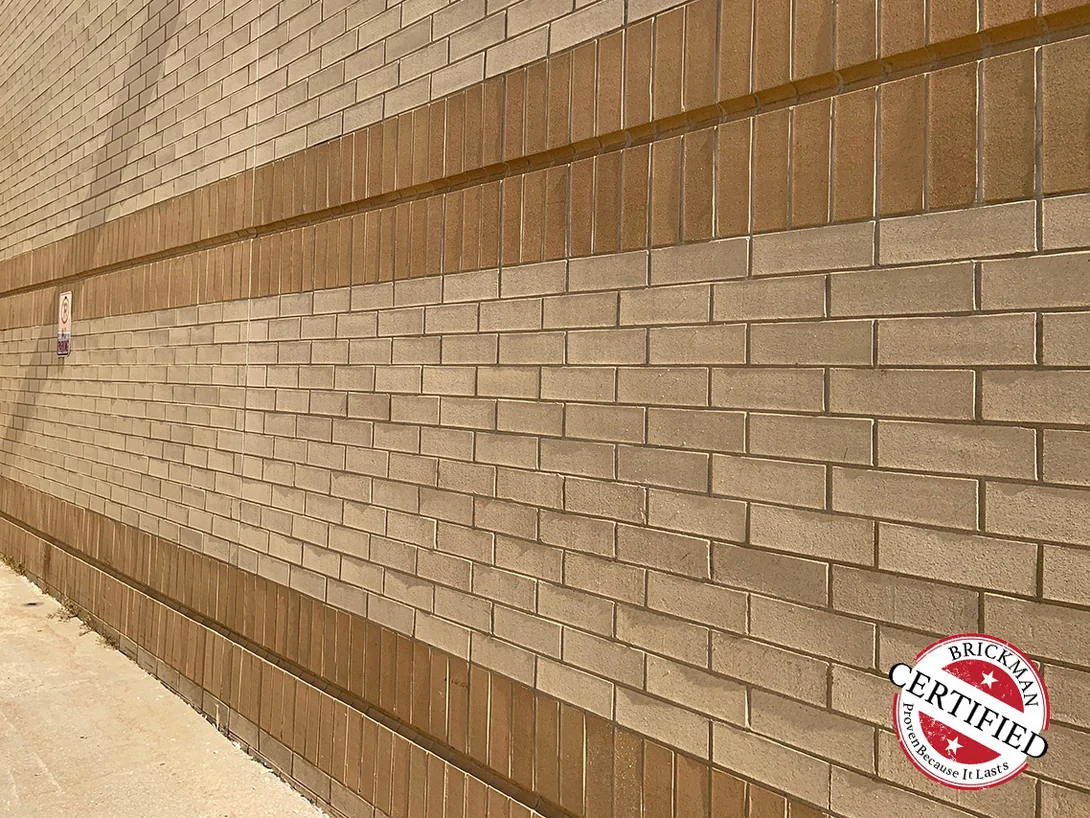 The mall wall in 2019 seen along its length, the soldier bands holding an even tan against the buff field