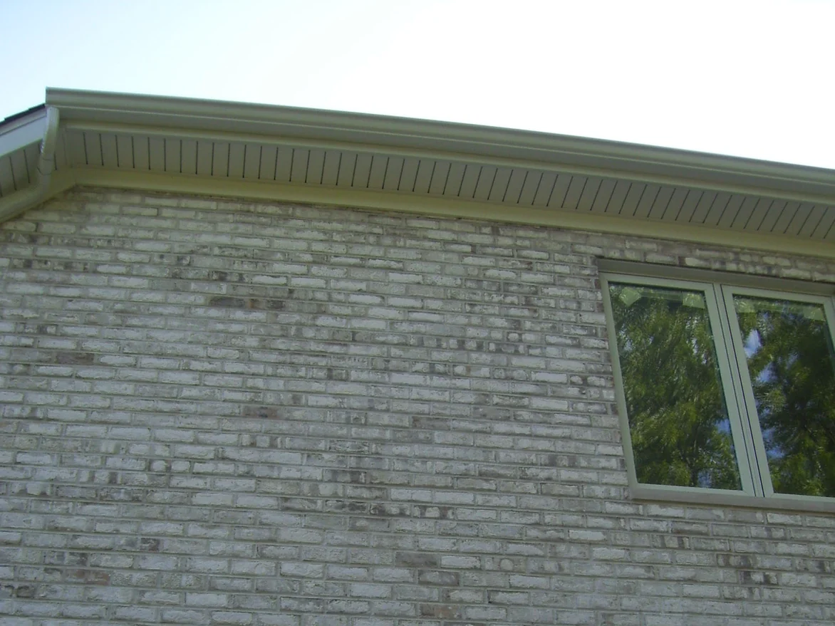 The upper gable end in 2008 under a white soffit, the pale brick blotched with darker grey and rust coloured units