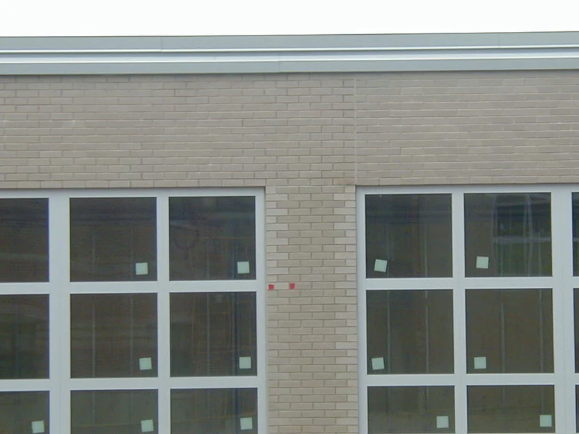 The window band during the 2004 work, the brick pier between the two window groups still lighter than the wall around it