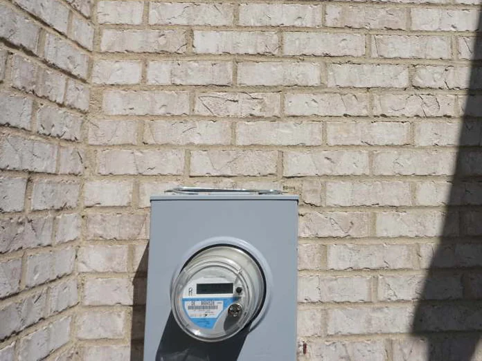 The inside corner above the electric meter in 2019, the brick face one pale range with no exposed red body