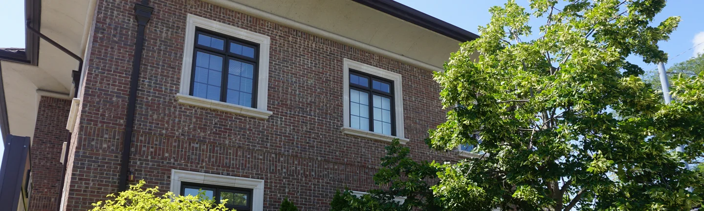 The Plymouth office seen from the pavement in 2019, its blended brick reading as one consistent wall