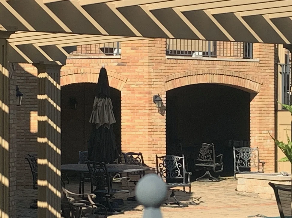 The covered terrace and its brick arcade in 2019, the arch heads and pier corners in the same range as the brick around them