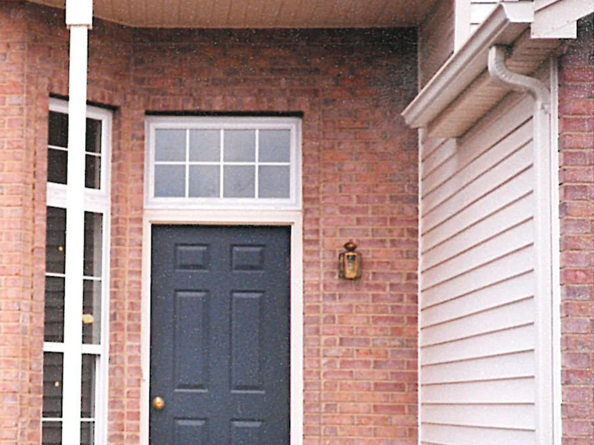 The same entry later in 1997, the door surround and the header course now sitting in the same red and buff range as the wall