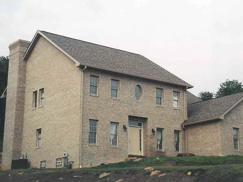 The front of the house in 2000 with the work finished, the brick reading as one even color across the main block and the wing