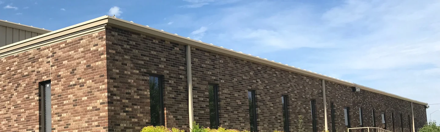 The South Bend office in 2019, its stained brick running the length of the elevation as one even wall