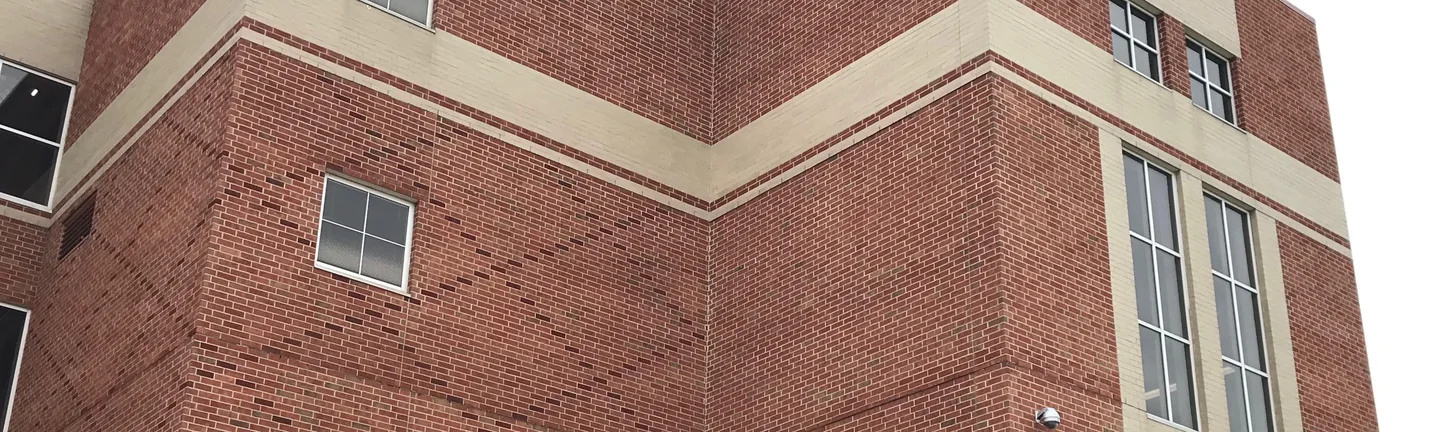 The corner of the South Bend high school in 2019, red brick banded with buff across three storeys