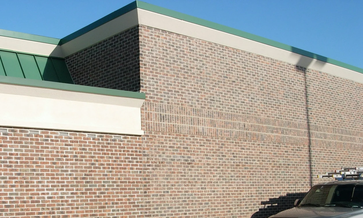 The corner where a store addition meets the original building, the new brick stained to match the old in 2007