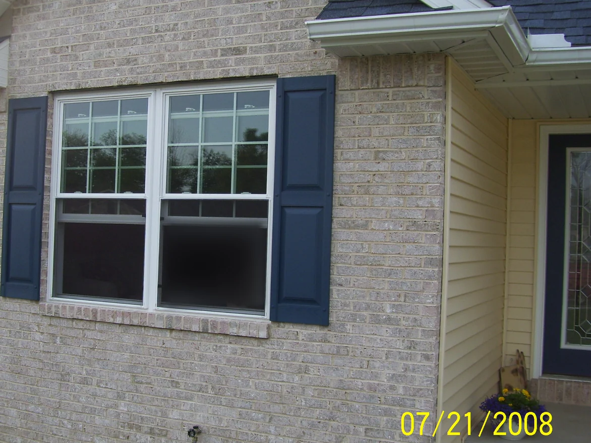 The same window later on 21 July 2008, the course under the sill lightened to sit inside the range of the wall, the shutters and the camera date unchanged
